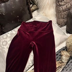 Spanx deep burgundy velvet leggings.